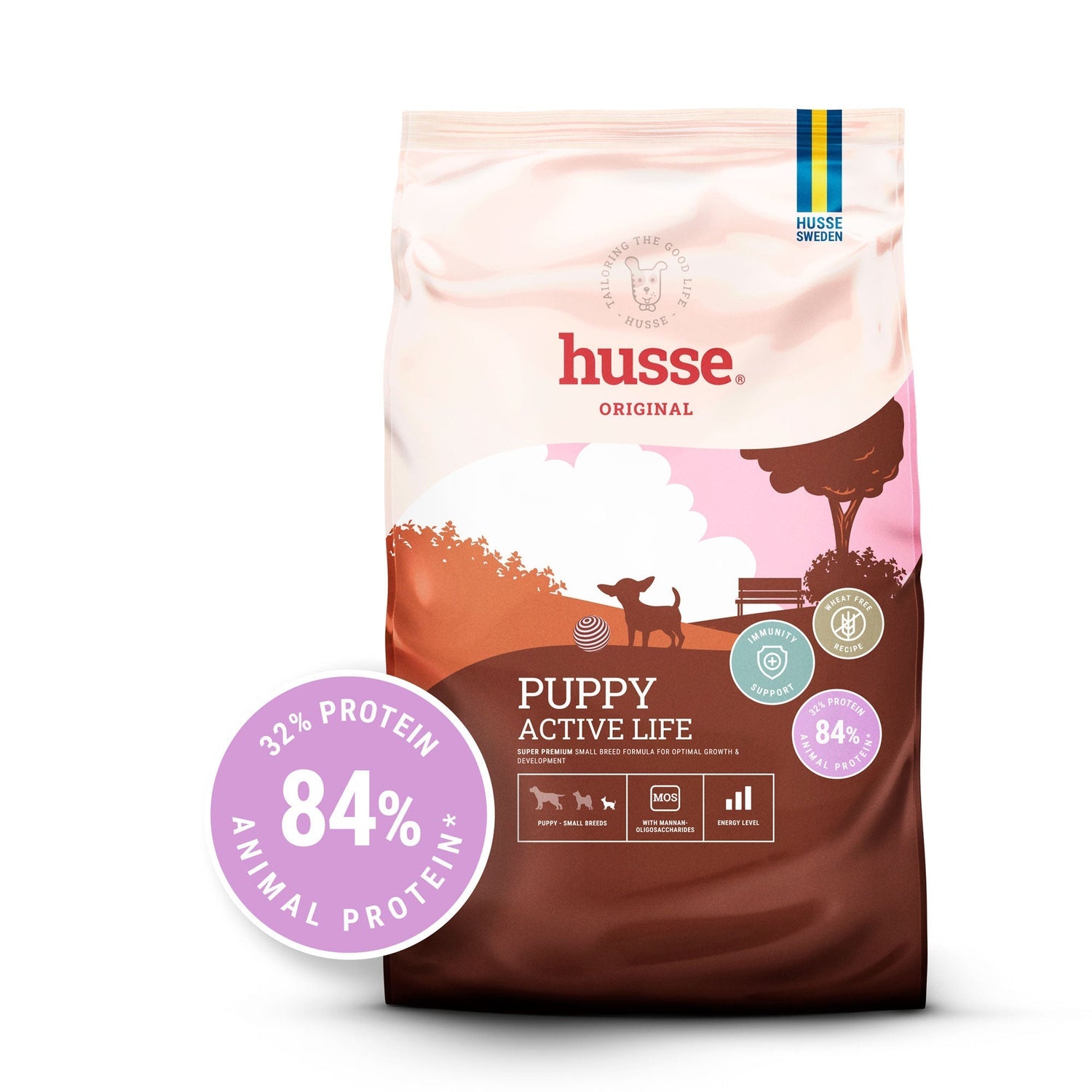 Ração seca Husse Puppy Active Life para cachorros de raças pequenas num saco castanho e rosa com 84% de proteína animal.