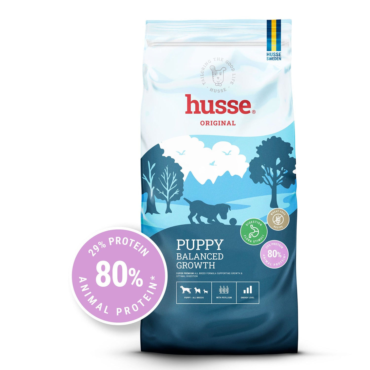 Saco de ração seca Husse Puppy Balanced Growth com paisagem azul e selo rosa de 80% de proteína animal.