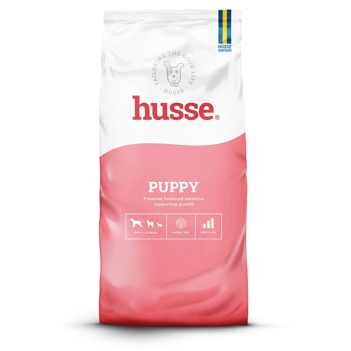 Ração seca Husse Puppy em saco branco e cor-de-rosa, apoiando o crescimento e desenvolvimento saudável.