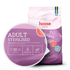 Husse Adult Sterilised cat food bag with a magnified inset highlighting energy and weight control benefits.