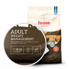 White and brown husse Adult Weight Management dry cat food bag with a zoom-in on the low-fat and fibre-rich label.