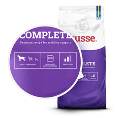 Ração seca Husse Complete para cães adultos de porte grande, em saco roxo com ícones de mobilidade e saúde digestiva.
