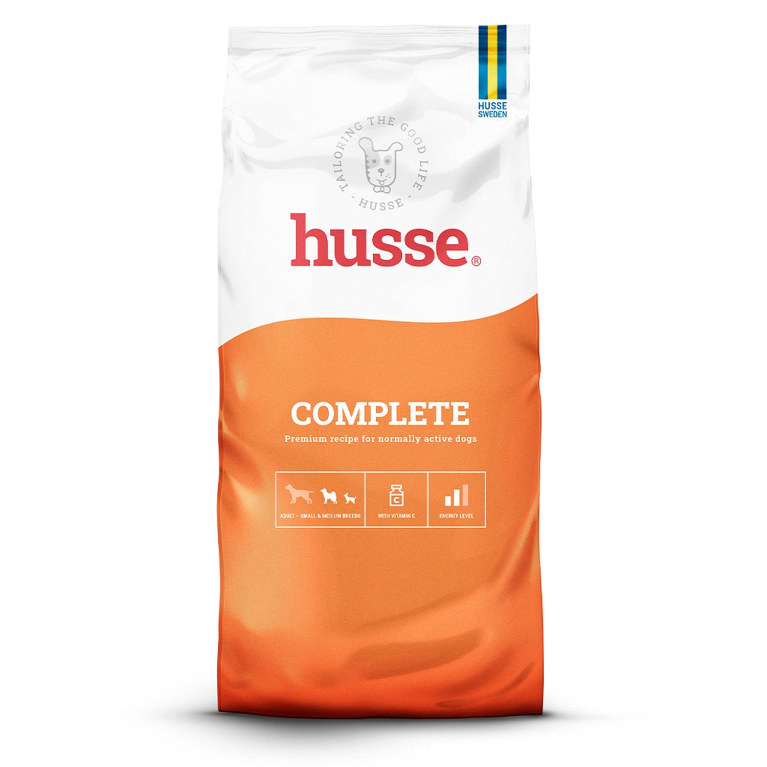 Ração seca Husse Complete em saco branco e laranja, para cães de raças pequenas e médias normalmente ativos.