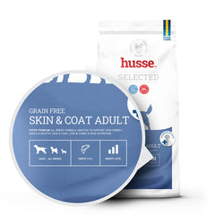 Husse Grain Free Skin & Coat Adult dog food bag with a blue circle highlighting Omega 3 & 6 and energy benefits.