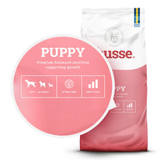 Ração seca Husse Puppy em embalagem rosa, detalhando nutrição equilibrada e fibra para um crescimento saudável.