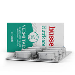 Husse Vermi Tabs 8 tablets blister pack for digestive hygiene in dogs and cats, shown in front of its green and white box.